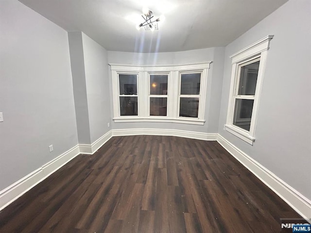 257 New St, Orange, NJ 07050 - empty room featuring dark wood-style floors and baseboards