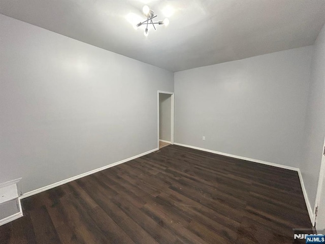 257 New St, Orange, NJ 07050 - empty room with dark wood finished floors and baseboards