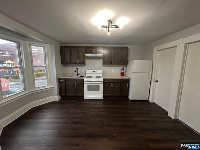 257 New St, Orange, NJ 07050 - kitchen featuring white appliances, a sink, light countertops, dark wood-style flooring, and under cabinet range hood