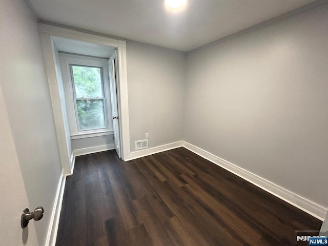 257 New St, Orange, NJ 07050 - unfurnished room featuring dark wood finished floors and baseboards