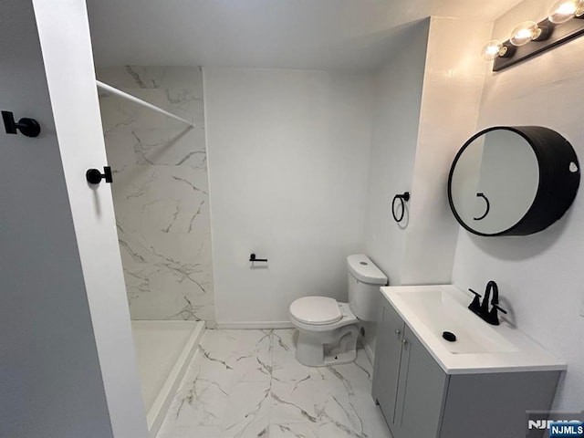 257 New St, Orange, NJ 07050 - bathroom with marble look tiles, a shower stall, toilet, and vanity