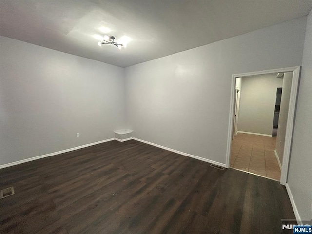 257 New St, Orange, NJ 07050 - empty room with wood finished floors and baseboards