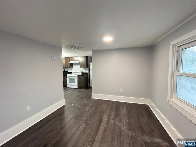 257 New St, Orange, NJ 07050 - unfurnished living room featuring baseboards, dark wood-style floors, and recessed lighting