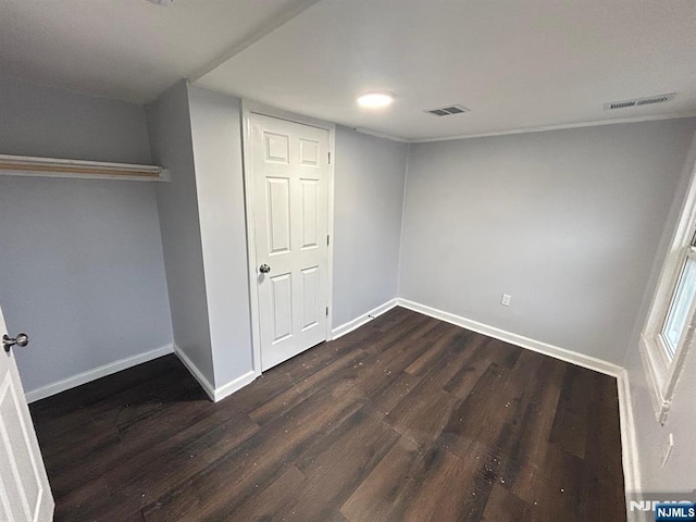 257 New St, Orange, NJ 07050 - unfurnished bedroom with dark wood-style flooring and baseboards
