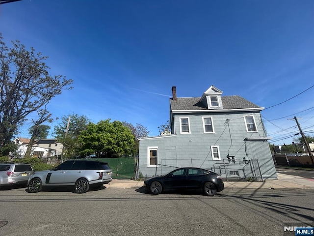 257 New St, Orange, NJ 07050 - rear view of property with a chimney
