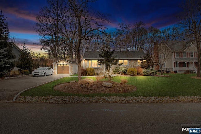 80 Haring Dr, Old Tappan, NJ 07675 - view of front facade featuring asphalt driveway, a lawn, a garage, and an outbuilding