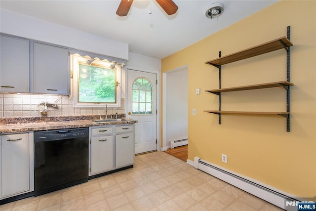 kitchen featuring dishwasher, baseboard heating, a sink, and light floors