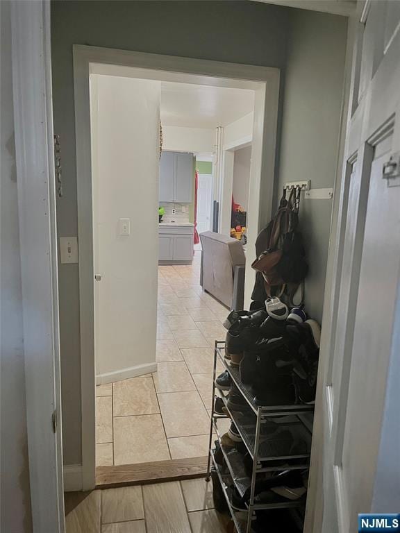 398 Cliff St, Fairview, NJ 07022 - corridor featuring baseboards and light tile patterned flooring