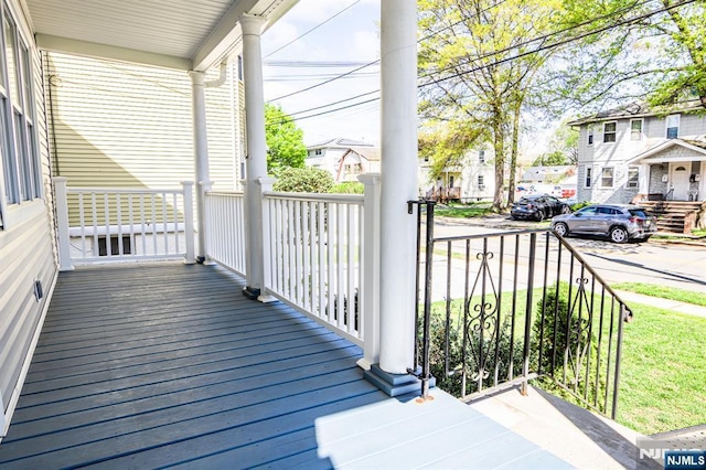 238 Milford Ave, New Milford, NJ 07646 - wooden deck featuring a porch and a residential view