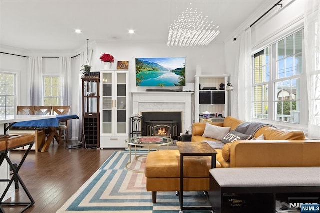 238 Milford Ave, New Milford, NJ 07646 - living area with plenty of natural light, ornamental molding, hardwood / wood-style flooring, a warm lit fireplace, and recessed lighting