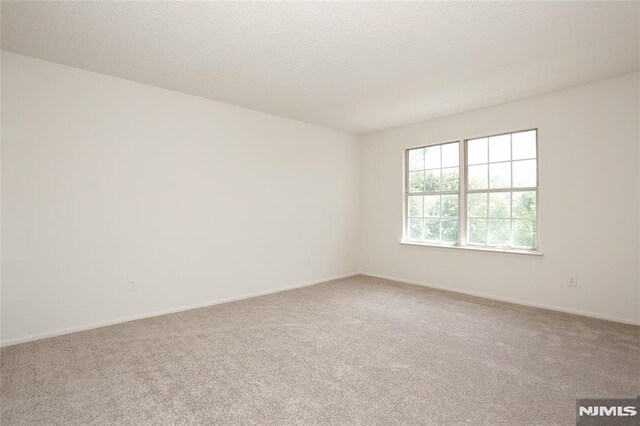 398 Poets Way Unit 398, Mahwah, NJ 07430 - spare room with carpet and baseboards