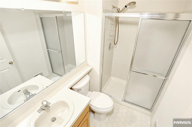 398 Poets Way Unit 398, Mahwah, NJ 07430 - bathroom with vanity, toilet, a shower stall, and tile patterned flooring