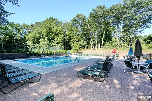 398 Poets Way Unit 398, Mahwah, NJ 07430 - community pool featuring a patio area