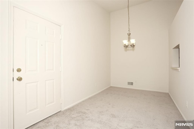 398 Poets Way Unit 398, Mahwah, NJ 07430 - unfurnished dining area featuring a chandelier, carpet flooring, and baseboards