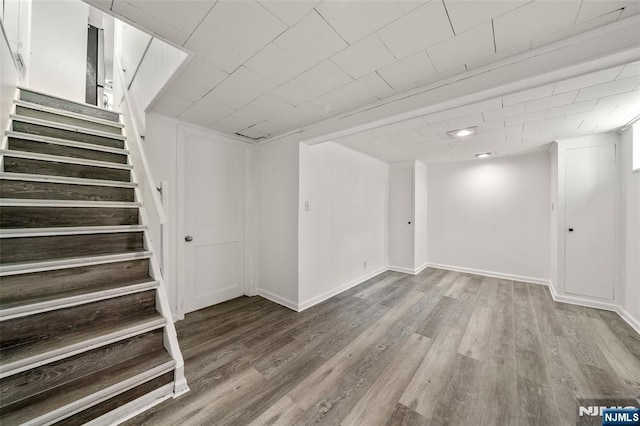 7 Edgewater Pl, Edgewater, NJ 07020 - finished basement featuring stairs, wood finished floors, and baseboards