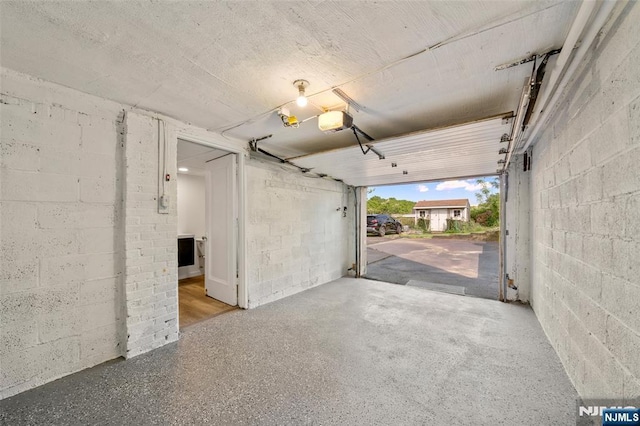 7 Edgewater Pl, Edgewater, NJ 07020 - garage with concrete block wall and a garage door opener