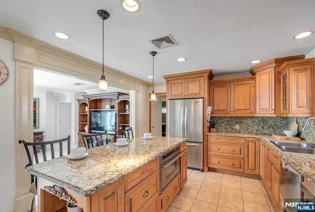32 Brookside Dr, Upper Saddle River, NJ 07458 - kitchen with appliances with stainless steel finishes, a sink, backsplash, light stone counters, and brown cabinets