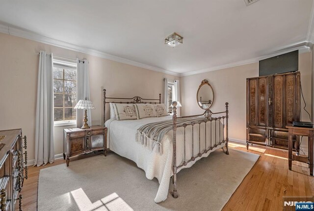 32 Brookside Dr, Upper Saddle River, NJ 07458 - bedroom featuring crown molding, hardwood / wood-style floors, and baseboards