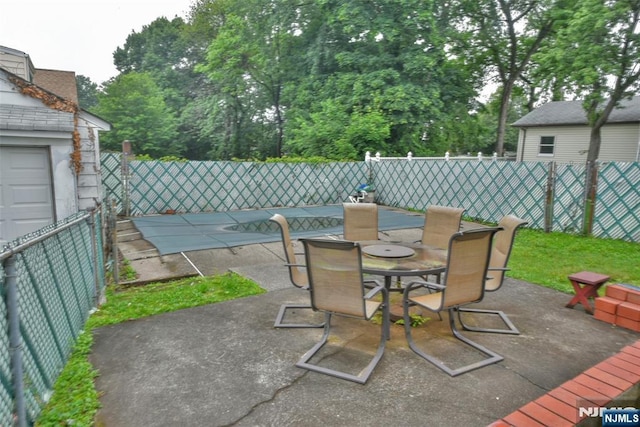 501 Collins Ave, Hasbrouck Heights, NJ 07604 - fenced backyard featuring a patio area and outdoor dining area