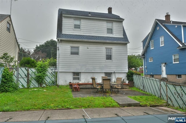 501 Collins Ave, Hasbrouck Heights, NJ 07604 - rear view of house featuring a patio area, a fenced backyard, roof with shingles, and a chimney