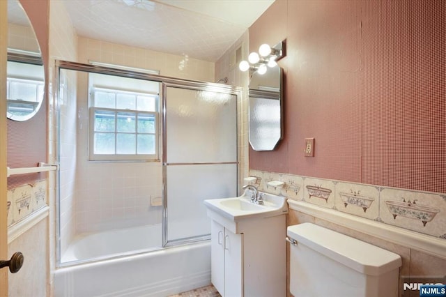 35 Mccosh Rd, Clifton, NJ 07043 - full bath featuring bath / shower combo with glass door, toilet, and vanity
