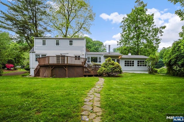 35 Mccosh Rd, Clifton, NJ 07043 - back of property featuring a wooden deck, stairway, and a lawn