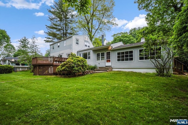 35 Mccosh Rd, Clifton, NJ 07043 - rear view of property featuring a deck, a yard, and a chimney