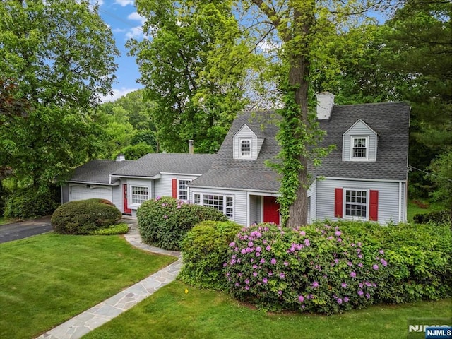 35 Mccosh Rd, Clifton, NJ 07043 - view of front facade with a chimney, a front yard, a garage, asphalt driveway, and a shingled roof
