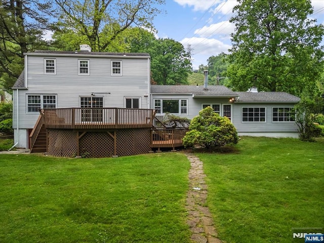 35 Mccosh Rd, Clifton, NJ 07043 - back of property featuring a deck, a chimney, a lawn, and stairway