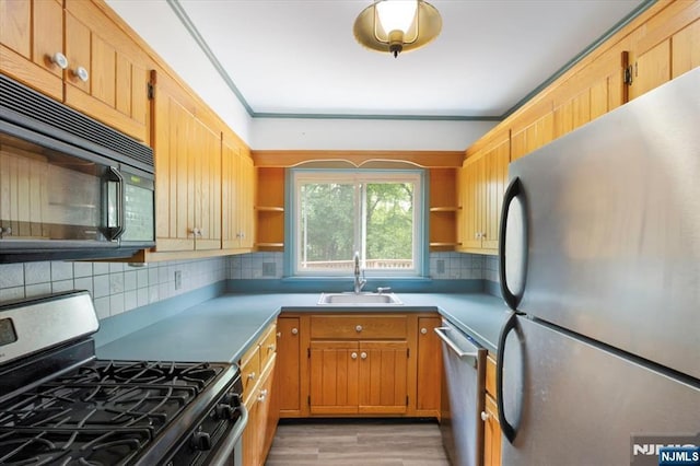 35 Mccosh Rd, Clifton, NJ 07043 - kitchen featuring stainless steel appliances, a sink, open shelves, and backsplash