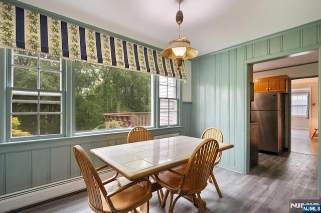35 Mccosh Rd, Clifton, NJ 07043 - dining space with wood finished floors and a baseboard radiator