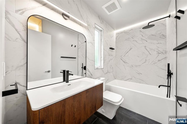 full bath with toilet, vanity, and shower / washtub combination