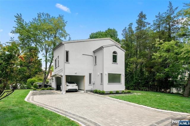 view of front of property featuring decorative driveway, a carport, stucco siding, and a front lawn
