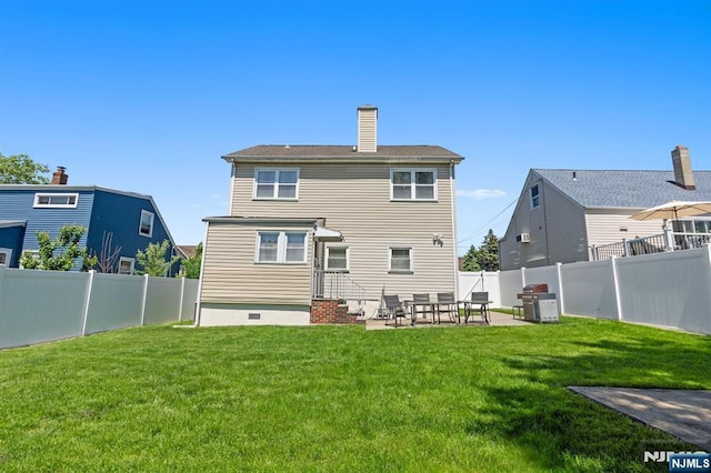 rear view of property with a patio, a chimney, and cooling unit