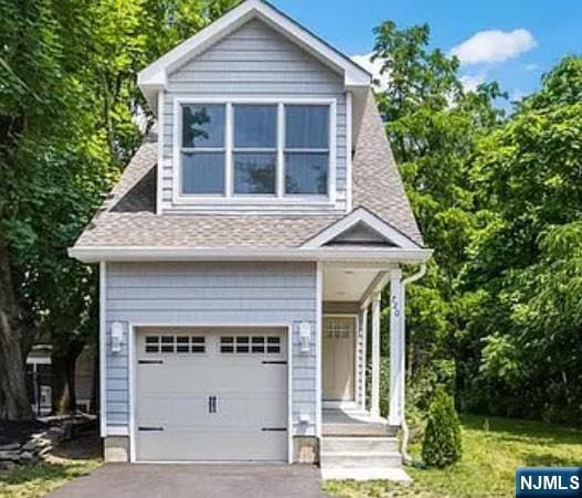 720 Kuser Rd, Hamilton, NJ 08619 - view of front facade featuring a garage, asphalt driveway, and a shingled roof