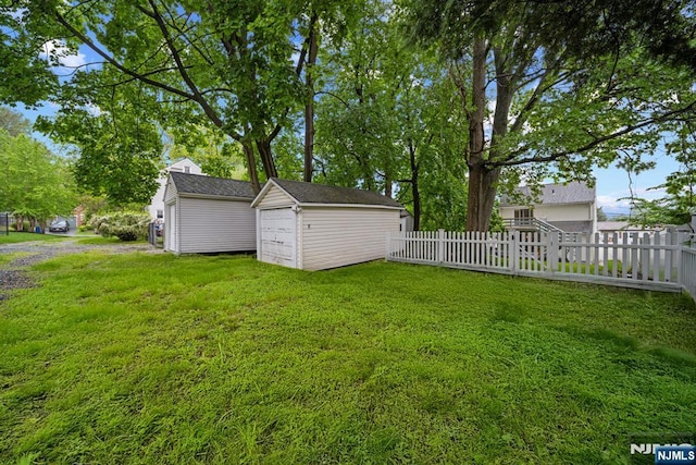 view of yard with an outbuilding and a shed