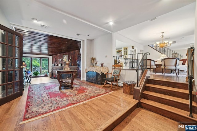 41-21 Dunkerhook Rd, Fair Lawn, NJ 07410 - living room with a chandelier, wood finished floors, and stairs
