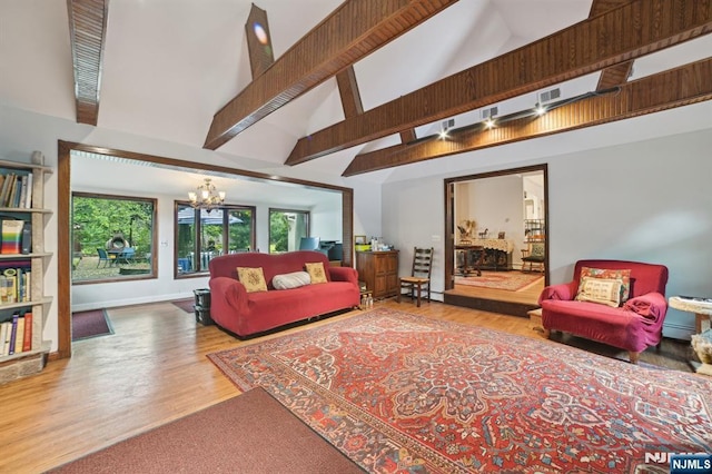 41-21 Dunkerhook Rd, Fair Lawn, NJ 07410 - living room featuring high vaulted ceiling, a chandelier, baseboard heating, and wood finished floors