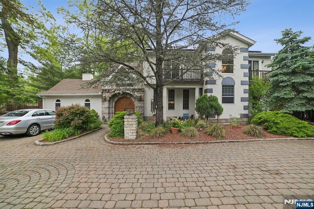 41-21 Dunkerhook Rd, Fair Lawn, NJ 07410 - view of front facade featuring a balcony and stucco siding