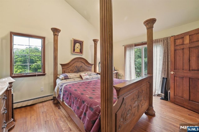 41-21 Dunkerhook Rd, Fair Lawn, NJ 07410 - bedroom with a baseboard radiator, lofted ceiling, light wood-style floors, and decorative columns