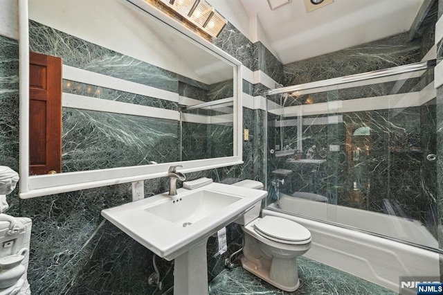41-21 Dunkerhook Rd, Fair Lawn, NJ 07410 - full bath with tile walls, bath / shower combo with glass door, toilet, and vaulted ceiling