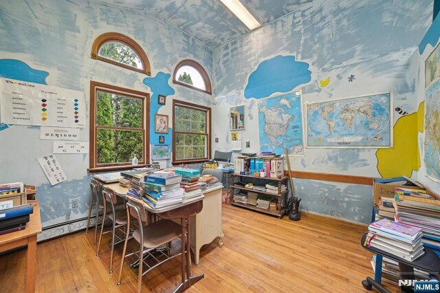 41-21 Dunkerhook Rd, Fair Lawn, NJ 07410 - office space featuring wood finished floors, wallpapered walls, a baseboard heating unit, and a high ceiling