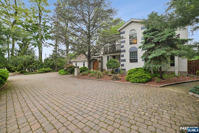 41-21 Dunkerhook Rd, Fair Lawn, NJ 07410 - view of front of home featuring a balcony, stucco siding, and driveway