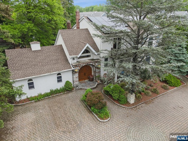 41-21 Dunkerhook Rd, Fair Lawn, NJ 07410 - view of front facade featuring stucco siding, a shingled roof, and a chimney
