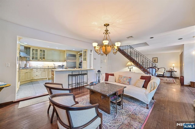 41-21 Dunkerhook Rd, Fair Lawn, NJ 07410 - living area with a chandelier, stairs, hardwood / wood-style flooring, baseboards, and recessed lighting