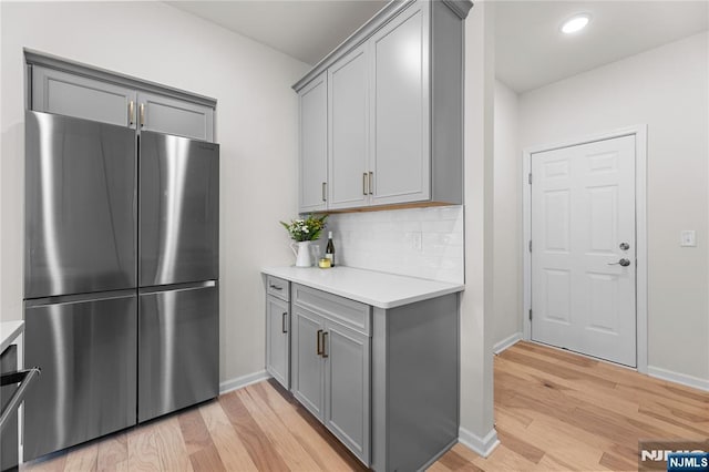 11 Arnold Dr, Wood Ridge, NJ 07075 - kitchen featuring freestanding refrigerator, gray cabinetry, light wood-style flooring, light countertops, and recessed lighting
