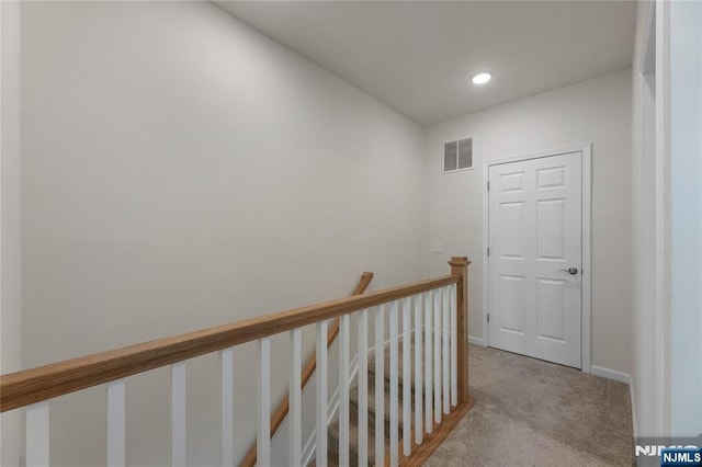 11 Arnold Dr, Wood Ridge, NJ 07075 - corridor featuring light carpet, an upstairs landing, baseboards, and recessed lighting