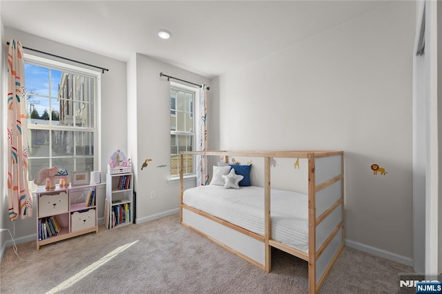 11 Arnold Dr, Wood Ridge, NJ 07075 - bedroom featuring multiple windows, carpet floors, and baseboards