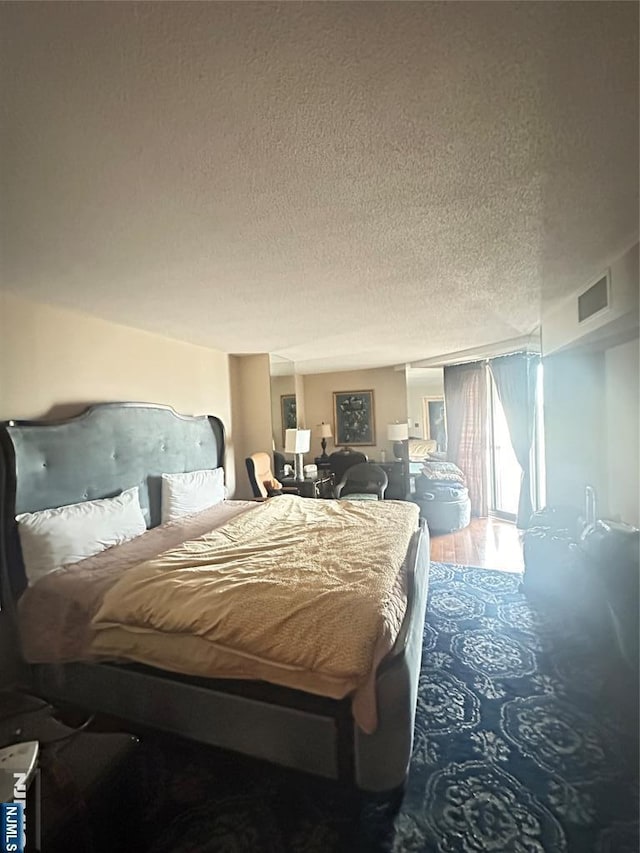 245 Prospect Ave Unit 5B, Hackensack, NJ 07601 - bedroom with a textured ceiling