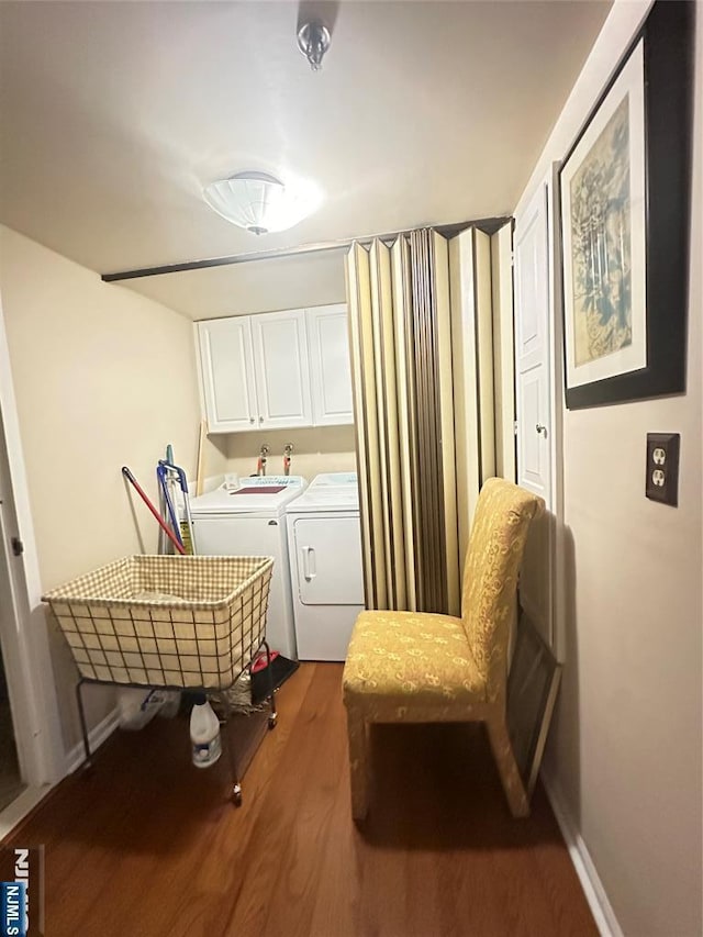 245 Prospect Ave Unit 5B, Hackensack, NJ 07601 - laundry area featuring separate washer and dryer, cabinet space, wood finished floors, and baseboards